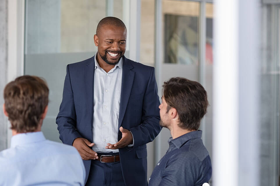 Mature business man in meeting smiling