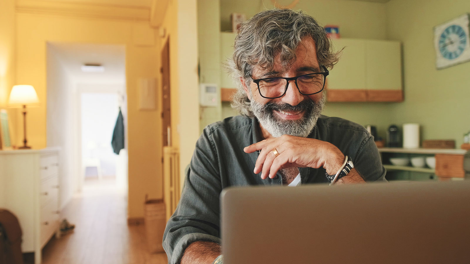 Man using his laptop to pay a bill online.