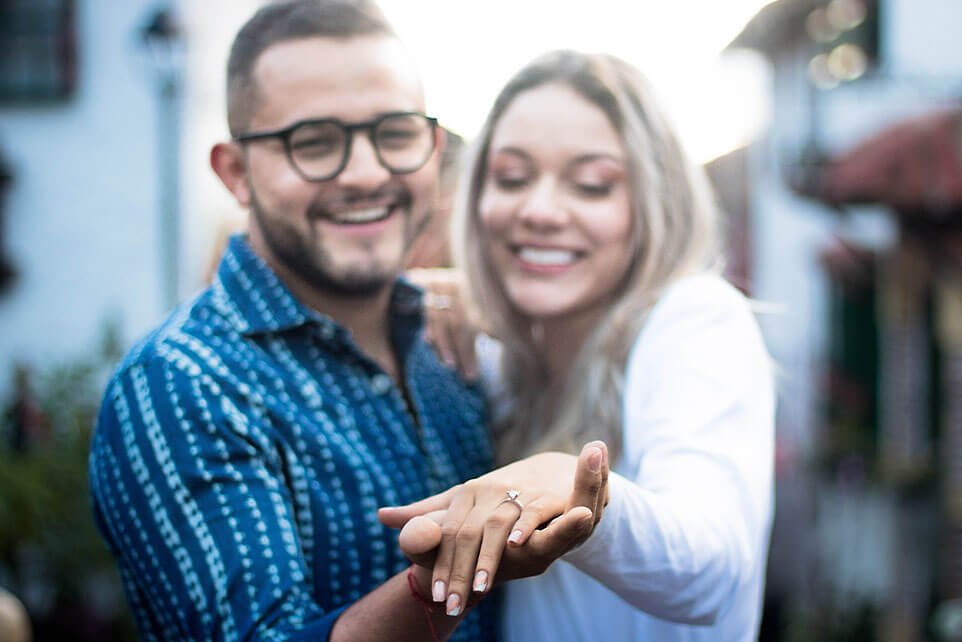 Happy couple just married showing the ring